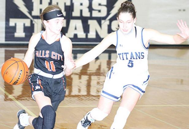 HTRS’ Ellie Schaardt (#5, right) defends against a Falls City player in Thursday night’s game. Paula Jasa/Republican