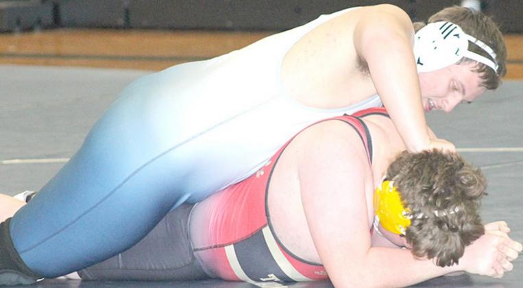 HTRS/P.C’s Ty Faulks (on top) strives to keep his JCC opponent down on the mat. Paula Jasa/Republican