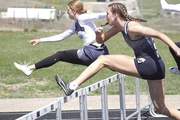 HTRS’ Makena Dunlap (right) clears her second hurdle in the girls’ 100 M. event on Tuesday at the Lewiston Invitational. Dunlap finished 4th with a time of 19.42. Paula Jasa/Republican