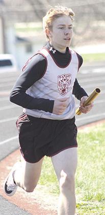 Paula Jasa/Republican LHS’ Evan Christen runs his leg of the boys’ 3200 M. relay.