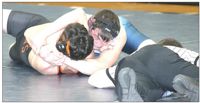 TRS/P.C.’s Wyatt Anderson pins his opponent Calvin Crouse to the mat in the 160 lb. match. Anderson won by a fall in 1:19. Paula Jasa/Republican