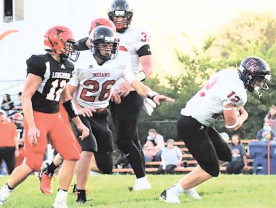 P.C.’s Andy Maloley (#12) breaks through the line at the Dorchester game on Friday. Maloley scored all of the Indian’s touchdowns in their close 37-48 loss. photo courtesy of Jamie Maloley