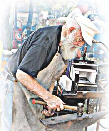 Camp Creek Threshers Show had this blacksmith at work, keeping the craft alive. Photo by Tonia Mannschreck