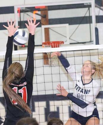 P.C.’s Madison Branek (#11, left) gets her hands on an ace block against HTRS’ Katilyn Glathar (#11, right). Paula Jasa/Republican