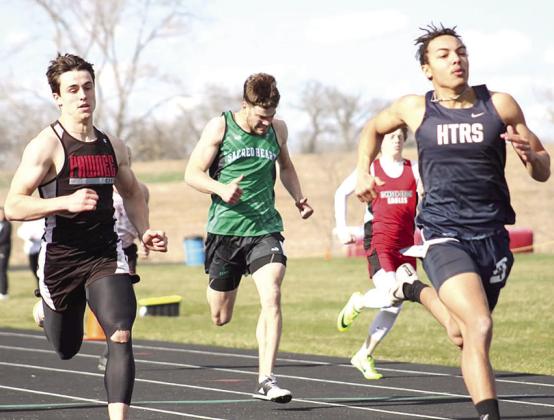 HTRS’ J.J. McQueen (right) finishes just ahead of P.C.’s Jett Farwell (left) in the boys’ 200 M. Dash at the JCC Invitational last Tuesday. Photo courtesy of Jamie Maloley