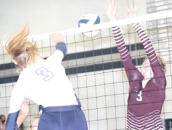 HTRS’ Abby Stalder (#3) puts down a spike past Lewiston’s Katelyn Sanders (#3) in last week’s Tuesday night action. HTRS won the meeting in three sets. Paula Jasa/Republican