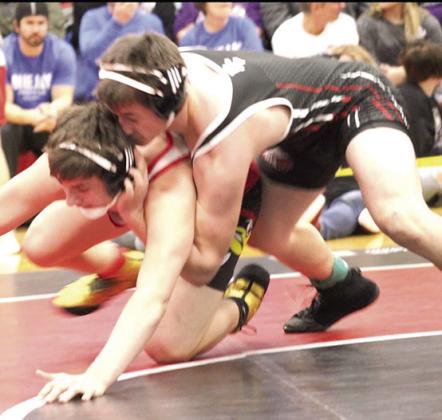 P.C.’s Jesse McLaughlin (on top) takes on a wrestler in the 165 lb. division at Districts. Photo provided by Jamie Maloley