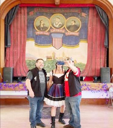 Before a recent performance, Angie Kriz with band members Craig &amp; Jason Falls take a selfie with the stunning curtain