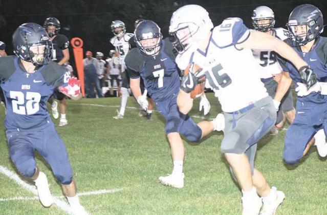 HTRS’ Rob Mather (#22, left), Josh Bachman (#12) and Donovan Kostecka try to run down Freeman’s quarterback Holden Ruse (#16) in Friday night action. Paula Jasa/Republican
