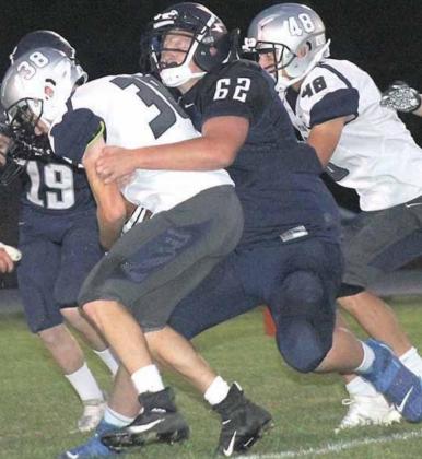 HTRS’ Ryken Davis (#62) prevents a PAT attempt in Friday night’s game. Paula Jasa/Republican