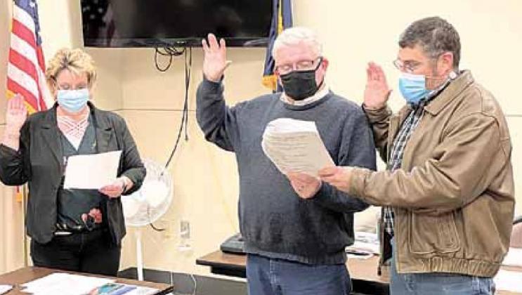 Pawnee City Clerk Tammy Curtis swears in new Council members Bruce Haughton and Donnie Fisher. Ray Kappel/Republican